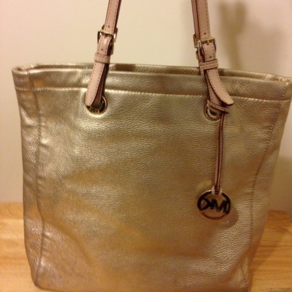 Gold metallic Michael Kors tote with hangtag